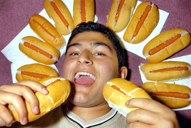 2005. Business administration student Moein Mousavi (19) at Portsmouth College, Tangier Road, Copnor, taking part in the All You Can Eat hotdog competition for Children In Need. Picture: Michael Scaddan (055277-0114)