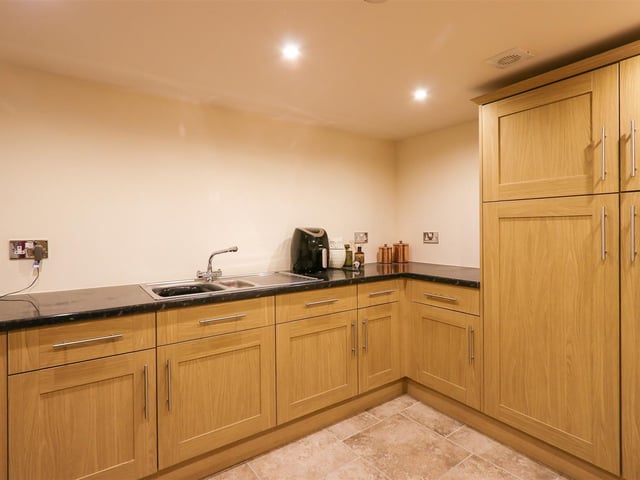 There is a large utility room next to the garage and shower room.