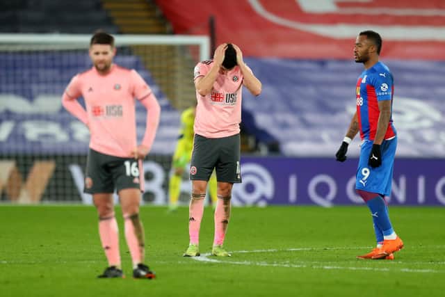 John Egan of Sheffield United looks dejected during the Premier League match between Crystal Palace and Sheffield United at Selhurst Park (Photo by Catherine Ivill/Getty Images)