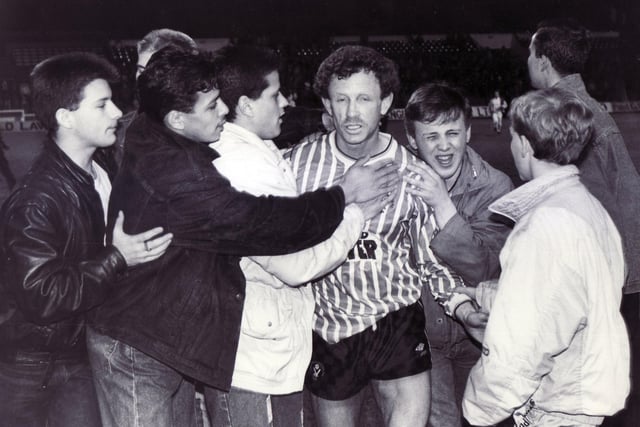 Colin Morris is mobbed by supporters at the final whistle following the play-off match agaainst Bristol City in May 1988