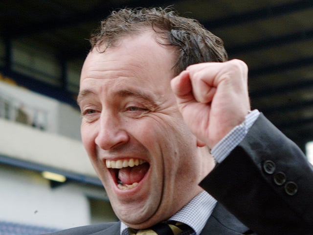 Soaked by champagne, chairman Keith Haslam celebrates Stags' promotion after the Carlisle game.