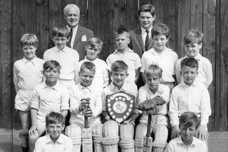 West Harton Junior School cricket team, pictured with headmaster W Davison, left and M Hails, coach in 1987.  Also pictured are back, left to right:  J Holmes, D Thompson, J Cummings, J Thompson, D Dent, D Davies. Centre: W Baker, D Patterson, S Millan , S Wilson, M McDonald.. Front: T Gibson, K Wood.