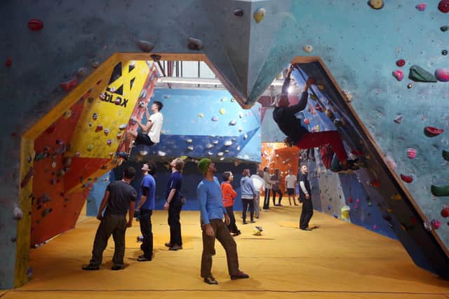SHEFFIELD, ENGLAND - JANUARY 30:  Climbers train at 'The Climbing Works' large indoor bouldering wall on January 30, 2014 in Sheffield, England. Bouldering is climbing without the need for ropes or harnesses on typically short, challenging routes. The Climbing Works bouldering wall has over 1000 square meters of climbing surface featuring hundreds of boulder problems. (Photo by Oli Scarff/Getty Images)