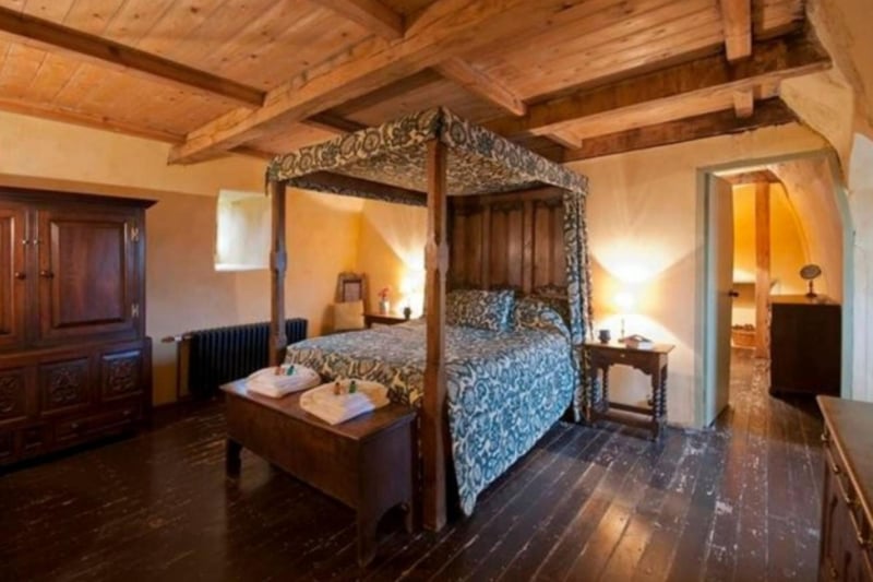 The master bedroom includes a kingsize four-poster bed.