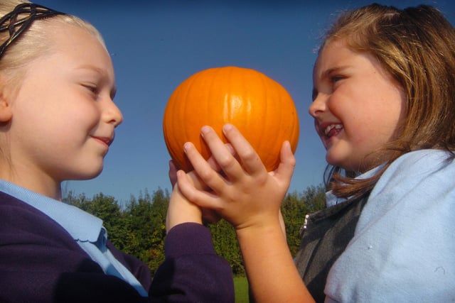 Courtney Easton, six and Laura Wordsworth, six, with a pumpkin, part of a large harvest festival gift to St Wilfred's Centre, Sheffield, from Sacred Heart Catholic Primary in 2007