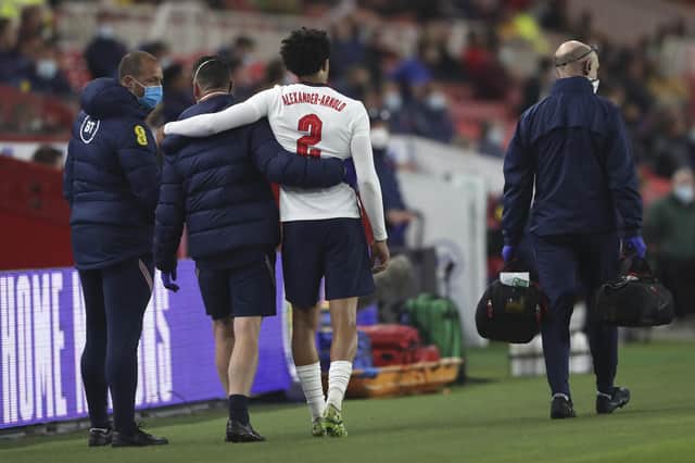 England's Trent Alexander-Arnold takes an assistance walk as leave the pitch after an injury during the international friendly match between England and Austria at the Riverside stadium in Middlesbrough. (AP Photo/Scott Heppell, Pool)