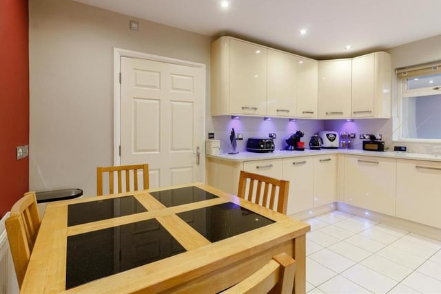 Everything about the kitchen is silky smooth. A tiled floor, ceiling spotlights, smoke alarm, radiator and large double-glazed window to the front of the bungalow complete its look.
