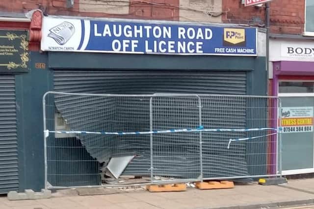 This is the front of an off licence in Dinnington, South Yorkshire – after reports a car was driven at it after trouble kicked off inside.