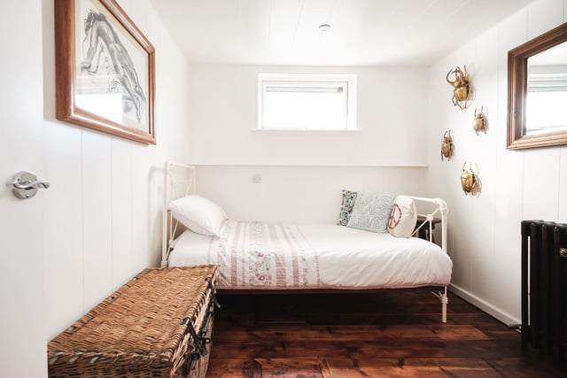 Inside one of the bedrooms in the converted coal barge on sale in Gosport
