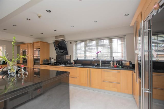 An entrance porch and a superb reception hallway guides you into the property. At the heart of it is this open-plan kitchen/diner that doubles up as a family room.