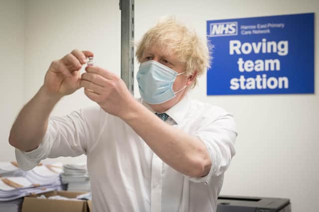 Prime Minister Boris Johnson sees how a dose of the Oxford/Astra Zeneca Covid 19 vaccine is prepared for a mobile vaccination centre - PA