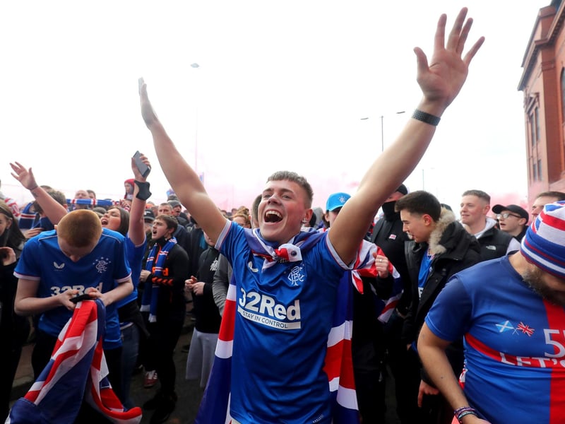 Rangers fans celebrate outside of the Ibrox Stadium after Rangers win the Scottish Premiership title.