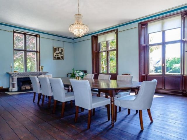 The striking dining room provides a spacious entertaining area, perfect for dinner parties. It comes with a unique, original fireplace, along with full height, double aspect windows and original, fully working shutters.