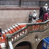 Star Wars scout troopers march down the magnificent staircase in Sheffield town hall  during the city’s Out of This World festival, a celebration of all things science fiction, magic, or Halloween. Doctor Who's TARDIS can be seen at the bottom of the picture