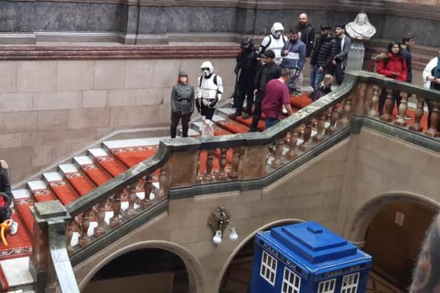 Star Wars scout troopers march down the magnificent staircase in Sheffield town hall  during the city’s Out of This World festival, a celebration of all things science fiction, magic, or Halloween. Doctor Who's TARDIS can be seen at the bottom of the picture