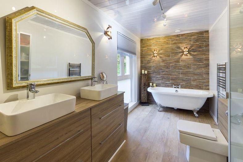 I have to admit to some bathroom envy here. My shower room pales in comparison to the master en-suite. What I wouldn't give to sink into that roll top bath...and I don't think I'll be alone in that.