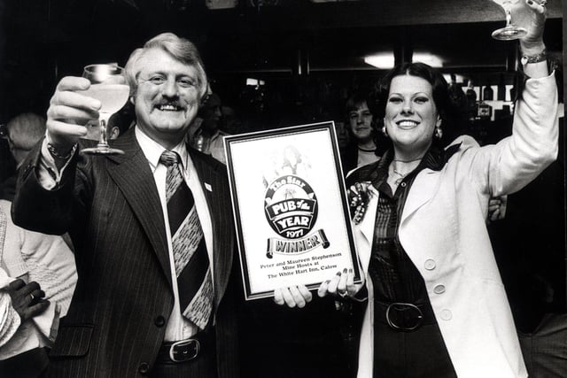 WHITE HART  -  Peter and Maureen Stephenson, in a  festive mood after receiving  their many prizes in The Star's Chesterfield-elected Pub of the Year Competition, for their pub The White Hart, at Calow.
30th May 1977
 