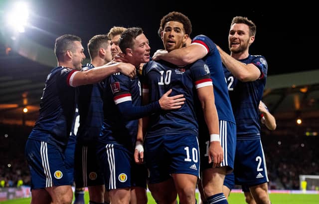 Scotland players celebrate after Che Adams (No.10) makes it 2-0 to Steve Clarke's side. Picture: SNS