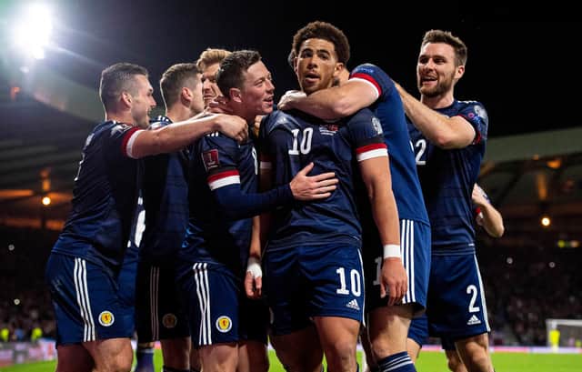 Scotland players celebrate after Che Adams (No.10) makes it 2-0 to Steve Clarke's side. Picture: SNS