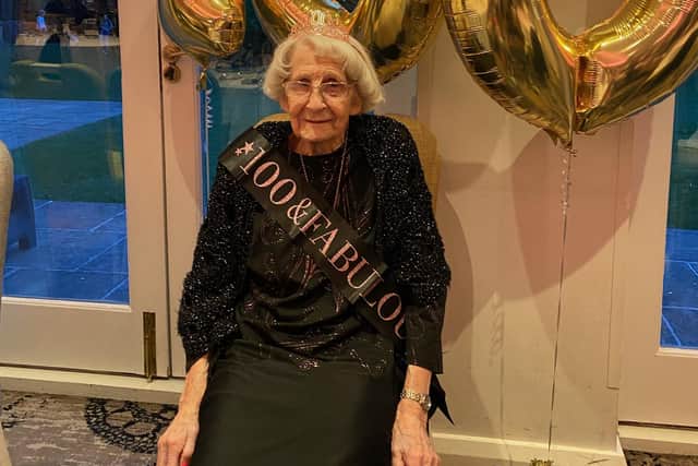 100-year-old Mabel Ash celebrates her 100th birthday with family and friends.