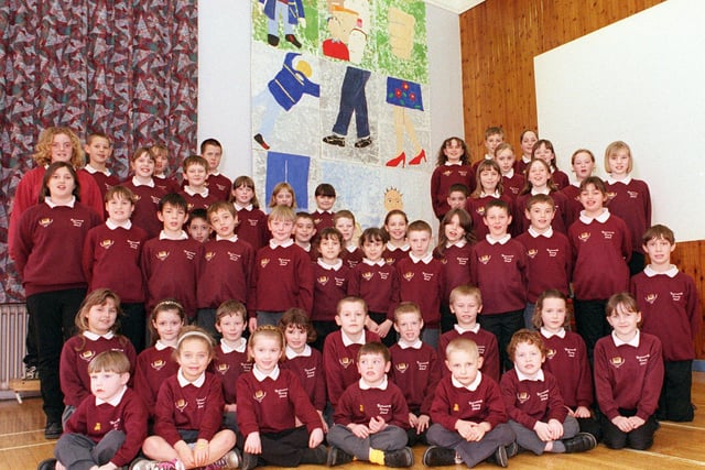 Pupils of Warmsworth primary school with thier artwork based on the good Samariton 