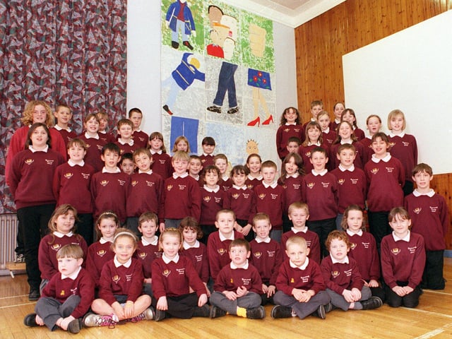 Pupils of Warmsworth primary school with thier artwork based on the good Samariton
