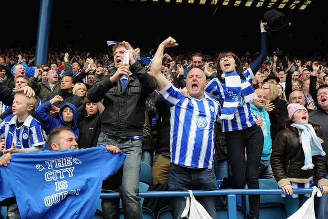 Sheffield Wednesday fans celebrate after winning the Npower League One match between Sheffield Wednesday and Wycombe Wanderers and winning automatic promotion into the Championship at Hillsborough Stadium on May 5, 2012.  (Photo by Gareth Copley/Getty Images)
