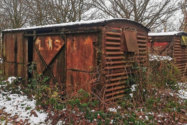 This rusting carriage shell has the initials LMS written on it, possibly referring to London, Midland and Scottish Railway