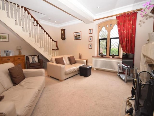 Stylish coving to the ceiling, with ambient downlighting, adds to the attractive appeal of the living room. The open feature staircase leads us to the first floor.