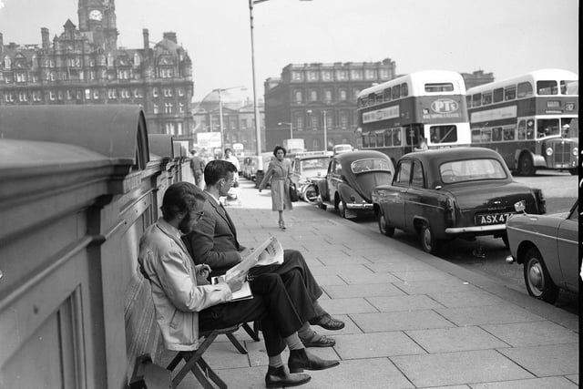 Two students check traffic flow as part of a survey on North Bridge in July 1962.