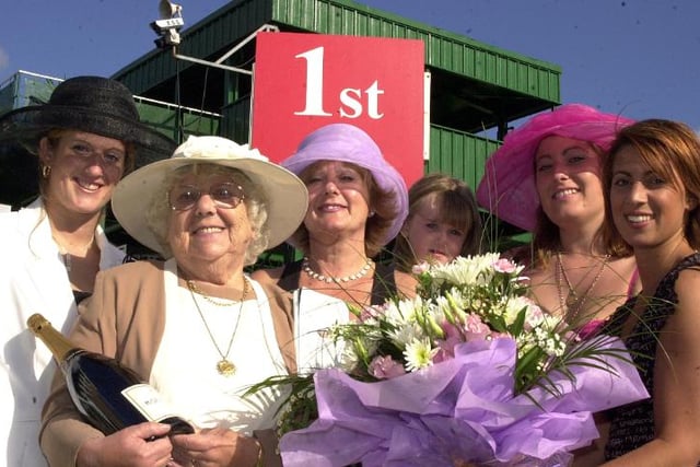 These ladies got free tickets to the St Leger in 2002 - they even got a mention on the Ladies Day card.