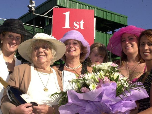 These ladies got free tickets to the St Leger in 2002 - they even got a mention on the Ladies Day card.