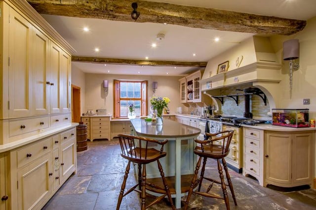 There is a hand-built Chalon kitchen which is fitted with an extensive range of wall, drawer and base units; silestone work surfaces; integrated Miele appliances; and a four-oven aga.