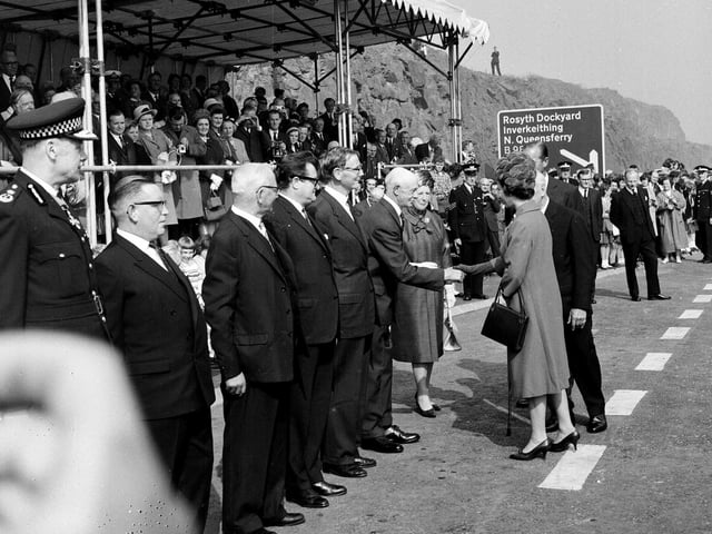 The Queen shakes hands with Sheriff Lillie in Fife while meeting some of those involved with the construction of the bridge at the opening in September 1964.