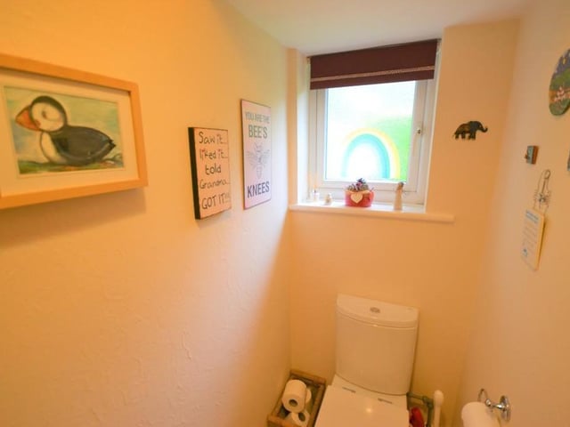 Cloakroom/WC - Accessed from the entrance hall, this useful room incorporates a low level flush wc, wash basin with chrome fittings ceramic splash back wall tiles and a UPVC double glazed obscure window.