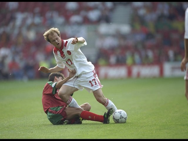 Abdullah Ercan of Turkey is brought down by a Portuguese defender in their Group D match at the City Ground. Portugal won 1-0.