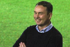 Morecambe's Derek Adams says Sheffield Wednesday, Derby County and Ipswich Town have the 'biggest budgets' in League One.