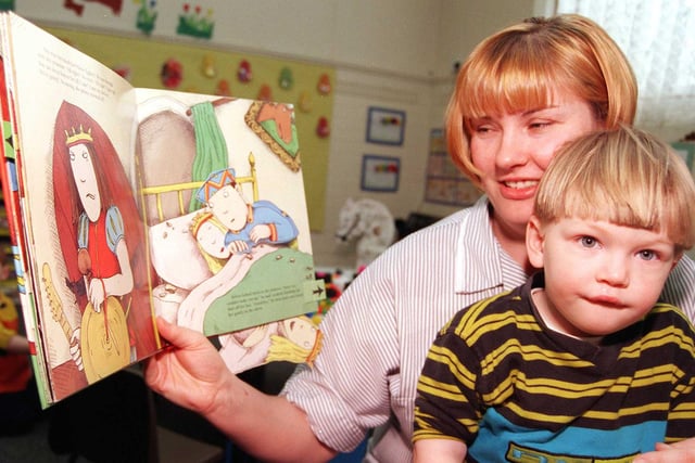Doncaster College's Sun Nursery held a sponsored read to buy books for its toddlers in 1999. Our picture how mum Elizabeth Burnip, of Bentley, reading to her sson Tyler, aged two.
