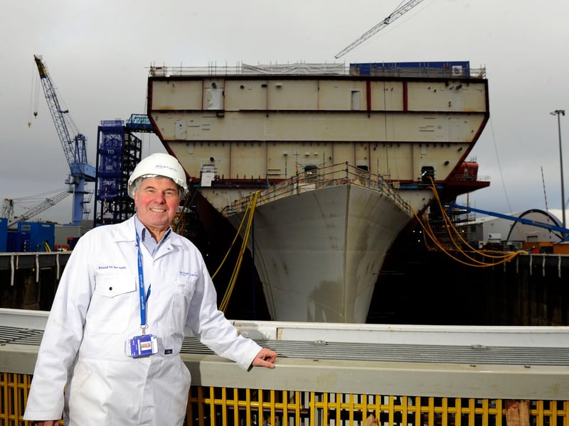 Tom Gifford at the front HMS Queen Elizabeth in December 2012 - when the future Royal Navy flagship was starting to take shape. Picture: Allan Hutchings (123920-409)