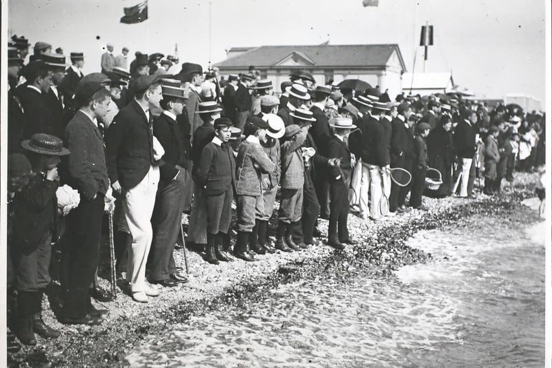 Crowds lined up along the beach at Southsea in the 1890s. Photo by F. J. Mortimer/Hulton Archive/Getty Images