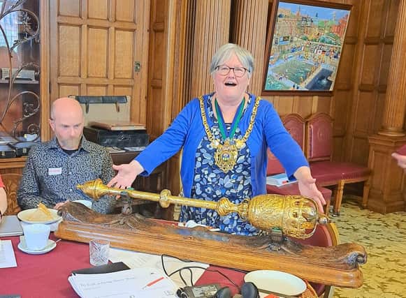 Cllr Sioned-Mair Richards, The Lord Mayor of Sheffield, with the ceremonial mace and potential murder weapon
