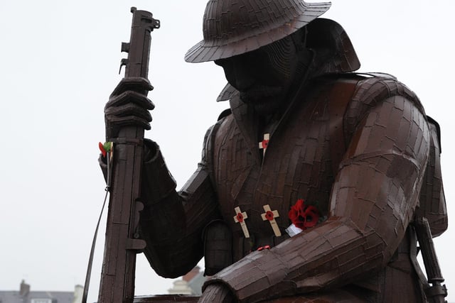 Seaham's famous Tommy statue is decorated with poppies.