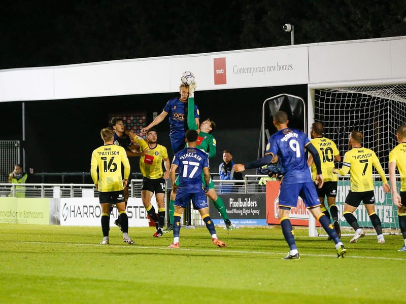 Mansfield Town midfielder George Lapslie's header is knocked clear.