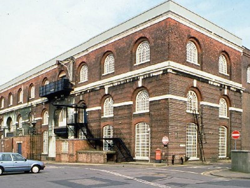 The Iron foundry and smithery, built 1857-1861 by Col GT Greene RE and Andrew Murray, Chief Engineer, was extended in 1878 with later alterations. The main part of the building was converted to office use in 2003. The east wing (Building 1/136) remains unused and at risk. There were concerns over drainage and regular flooding of the building but this has been resolved. Roof repairs are due to be undertaken. It has been given a priority C Grade, and is suffering from “slow decay”. It is a - Grade II* listed building and is described as being in a fair condition.