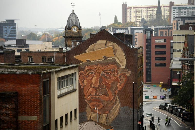 Here the "Steelworker" Brick Mural by Paul Waplington looks over Sheffield, known as the Steel City which has a population of 822,300. (Photo by Oli SCARFF / AFP)