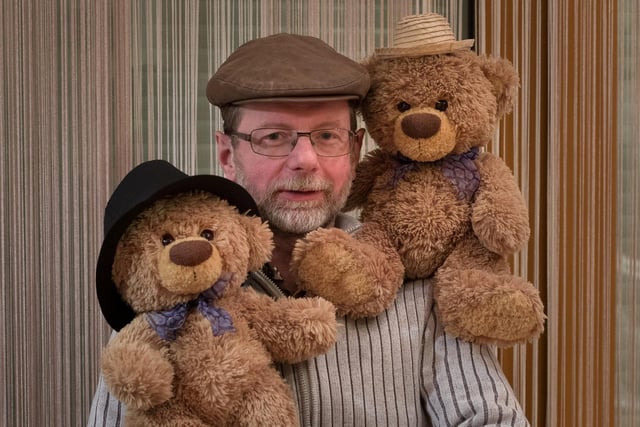 Christian Kneidinger with John James and Bob the teddy bears. 
These adorable teddy bears could be the world's most well-travelled cuddly toys - as their photographer owner has chronicled their adventures in 27 different countries. Christian Kneidinger, 57, has been travelling with his teddy bears, named John and Bob since 2014 - and his taken them to some of the world's most famous landmarks. The teddy bears have dressed up in traditional Emirati clothing to visit the Sultan's Palace in Oman, and have braved the cold on a glacier on Lofoten Island in Norway.
