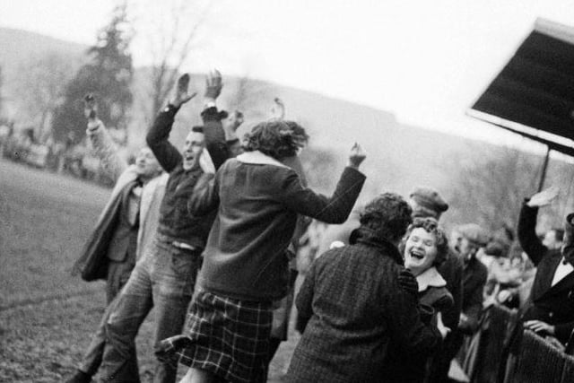 Rugby at the Greenyards - Melrose v Hawick, April 1963. Melrose supporters jump for joy at the end of the match.