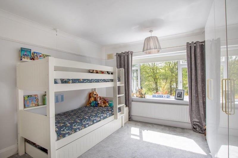 With good storage options and room for a bunk bed, this room looks perfect for children.