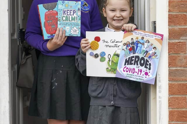 Swallownest Primary School Mia and Lillyanne Astle with their donated books
