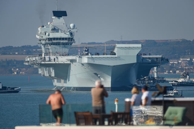 People watch on as HMS Queen Elizabeth departs. Picture: Finnbarr Webster/Getty Images